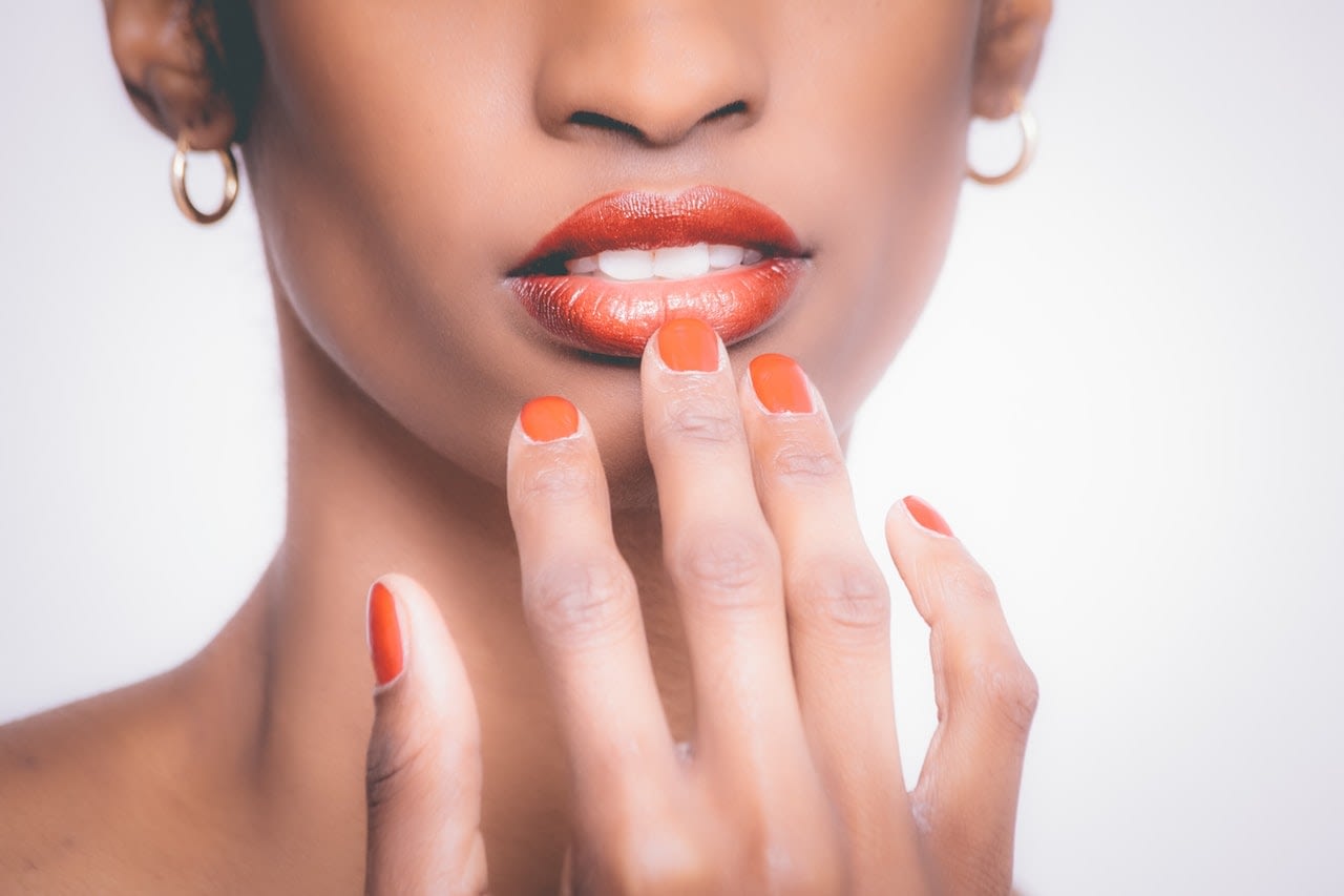 partial shot of a dark skinned woman's face